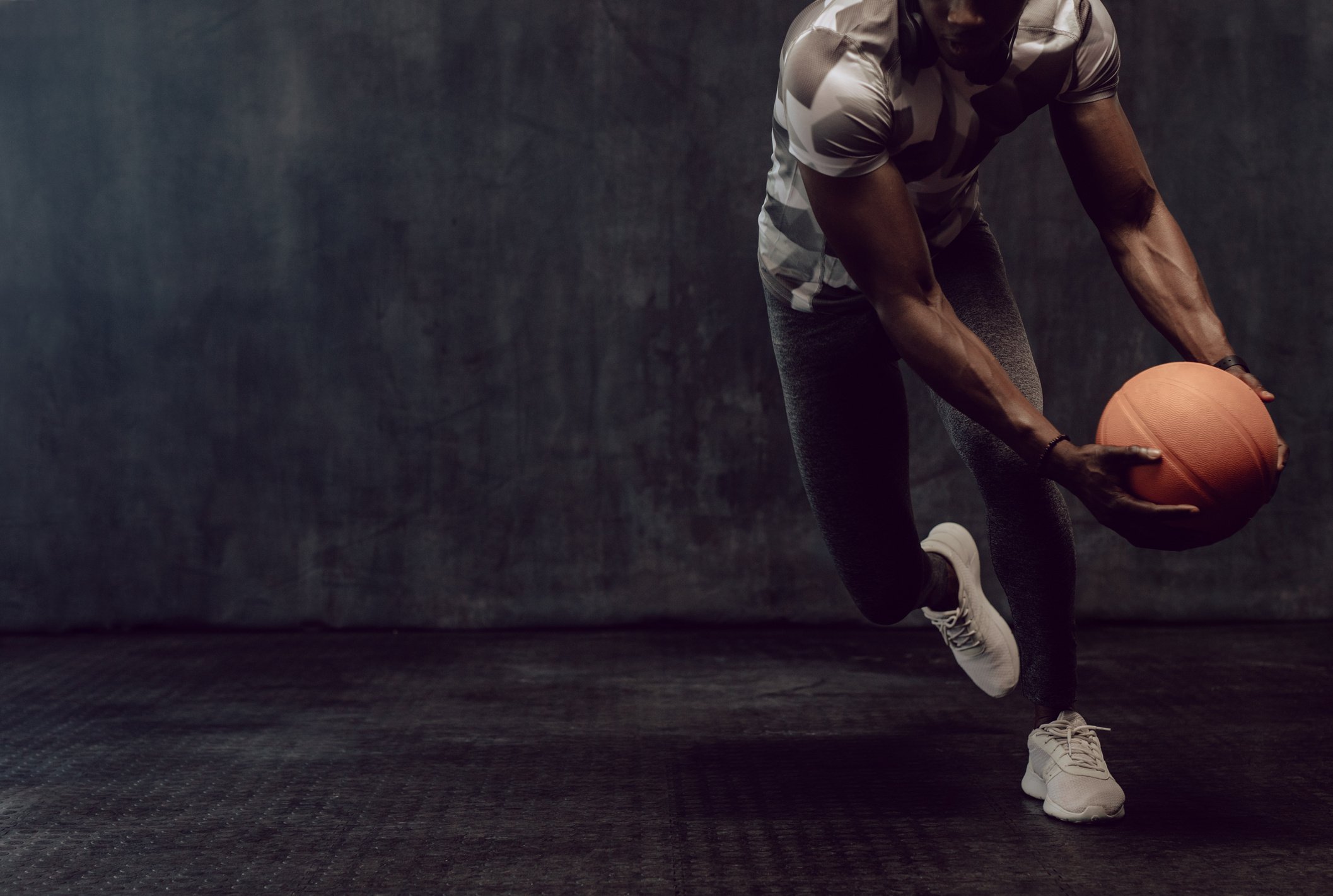 Crossfit Guy Training with Basketball